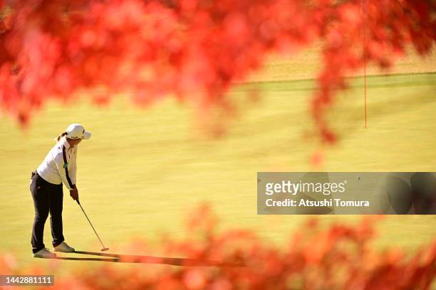 Ai Suzuki of Japan attempts a putt on the 5th green during the final round of Daio Paper Elleair Ladies at Elleair Golf Club Matsuyama on November...