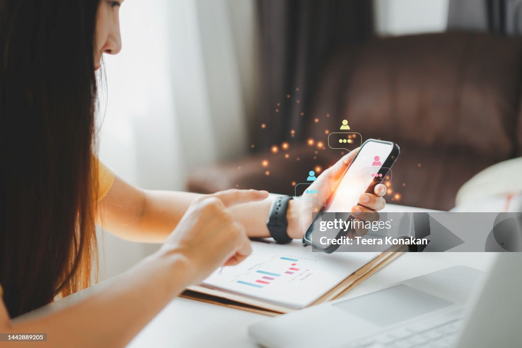 Woman using phone chatting social media on mobile phone with notification icon
