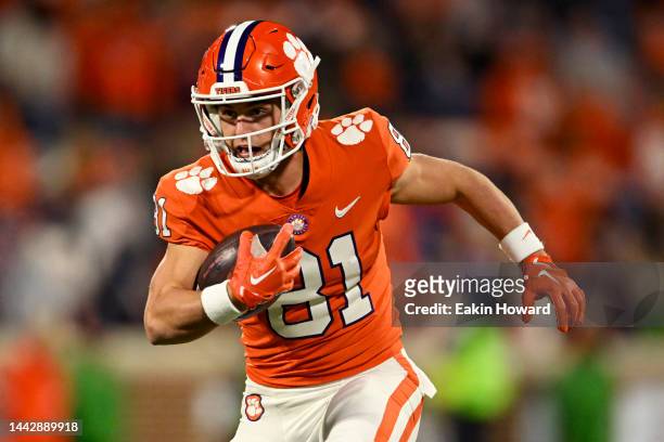 Drew Swinney of the Clemson Tigers runs the ball against the Miami Hurricanes in the fourth quarter at Memorial Stadium on November 19, 2022 in...