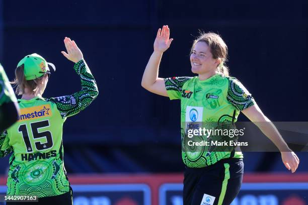 Hannah Darlington of Thunder celebrates the wicket of Tahlia McGrath of the Strikers during the Women's Big Bash League match between the Sydney...