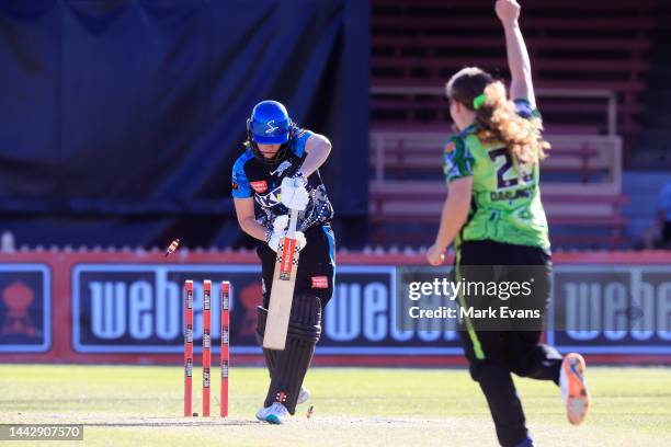 Tahlia McGrath of the Strikers is bowled by Hannah Darlington of Thunder during the Women's Big Bash League match between the Sydney Thunder and the...