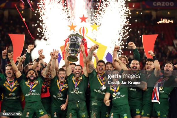 James Tedesco of Australia lifts the Rugby League World Cup trophy with teammates following victory during the Rugby League World Cup Final match...