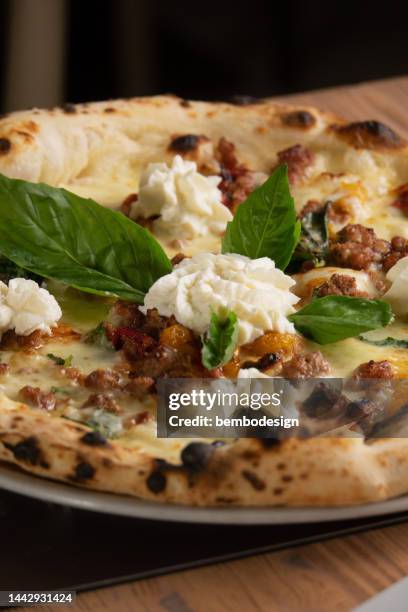 neapolitan pizza on the table - napoli pizza stock pictures, royalty-free photos & images