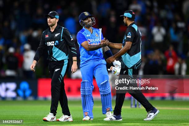 Ish Sodhi of the Black Caps congratulates Suryakumar Yadav of India during game two of the T20 International series between New Zealand and India at...