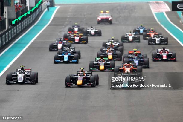 Ayumu Iwasa of Japan and DAMS and Roy Nissany of Israel and DAMS lead the field into turn one at the start during the Round 14:Yas Island feature...