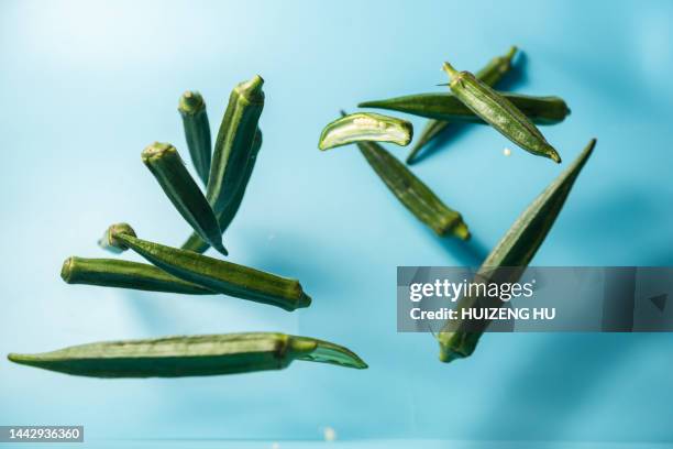 fresh okra flying in air - okra stock pictures, royalty-free photos & images