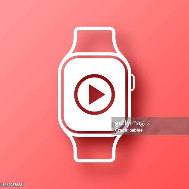 smartwatch with play button. icon on red background with shadow - play button 3d stock illustrations