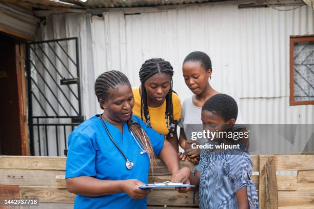 community nurse discussion with teenage girls in an informal settlement - community work africa stock pictures, royalty-free photos & images