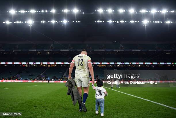 Owen Farrell of England is seen with his son after the Autumn International match between England and New Zealand at Twickenham Stadium on November...