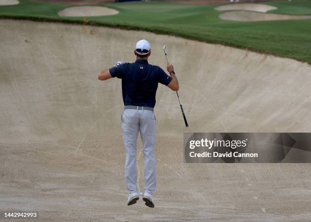 Maximillian Kieffer of Germany jumps to see his line for his second shot on the first hole during the final round on Day Four of the DP World Tour...