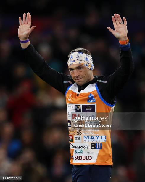 Kevin Sinfield, former Rugby League player, acknowledges the fans at half time after completing their Ultra 7 in 7 Challenge during the Rugby League...