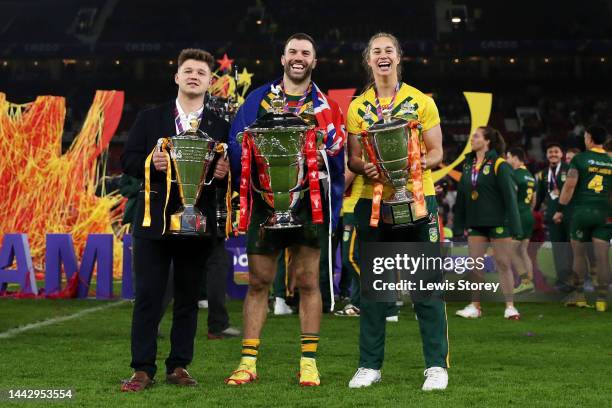 Tom Halliwell of England Wheelchair, James Tedesco of Australia and Kezie Apps of Australia pose for a photograph with their trophies after the Rugby...