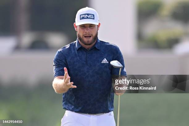 Tyrrell Hatton of England reacts after missing a putt on the 14th green during Day Four of the DP World Tour Championship on the Earth Course at...