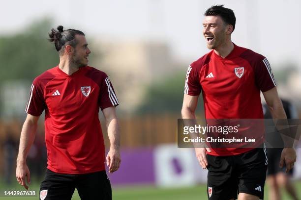 Gareth Bale and Keiffer Moore of Wales share a joke during the Wales match day -1 Training Session at on November 20, 2022 in Doha, Qatar.