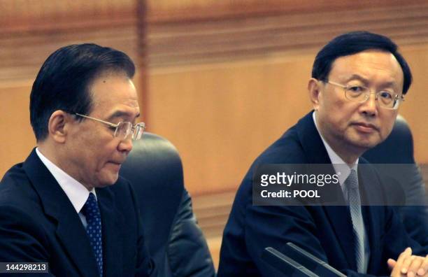 Chinese Premier Wen Jiabao and Foreign Minister Yang Jiechi attend a bilateral meeting with Japanese Prime Minister Yoshihiko Noda during the fifth...