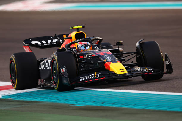 ABU DHABI F1 GP ABU DHABI, UNITED ARAB EMIRATES - NOVEMBER 20: Sergio Perez of Mexico driving the (11) Oracle Red Bull Racing RB18 during the Abu Dhabi F1 Grand Prix on November 20, 2022 Day at the Abu Yas Marina Circuit in Dhabi, United Arab Emirates.  Christian Horner, owner of Red Bull Racing.