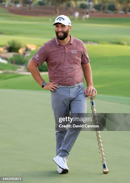 Jon Rahm of Spain poses with the DP World Tour Championship after the final round on Day Four of the DP World Tour Championship on the Earth Course...
