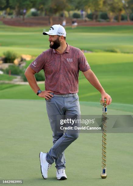 Jon Rahm of Spain poses with the DP World Tour Championship after the final round on Day Four of the DP World Tour Championship on the Earth Course...