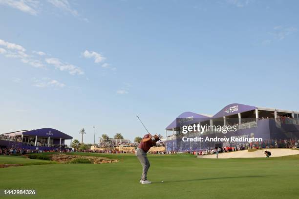 Jon Rahm of Spain plays his shot on the 18th hole during Day Four of the DP World Tour Championship on the Earth Course at Jumeirah Golf Estates on...