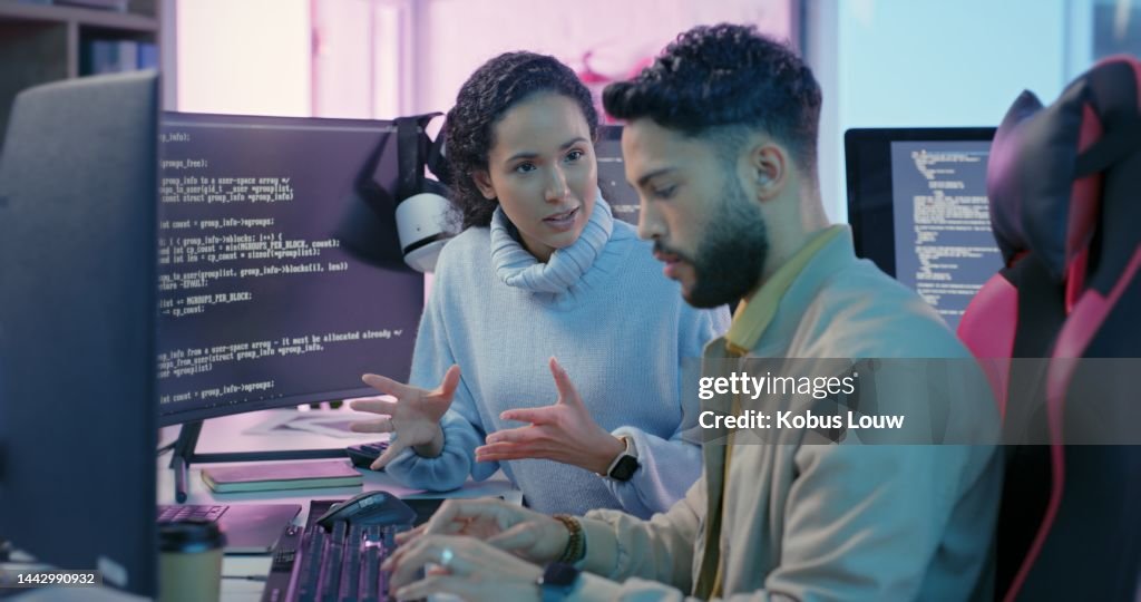Computer, woman programmer and man training for coding, cyber security or software on computer. Female IT specialist, male coder or talking to connect internet, information update and cloud computing