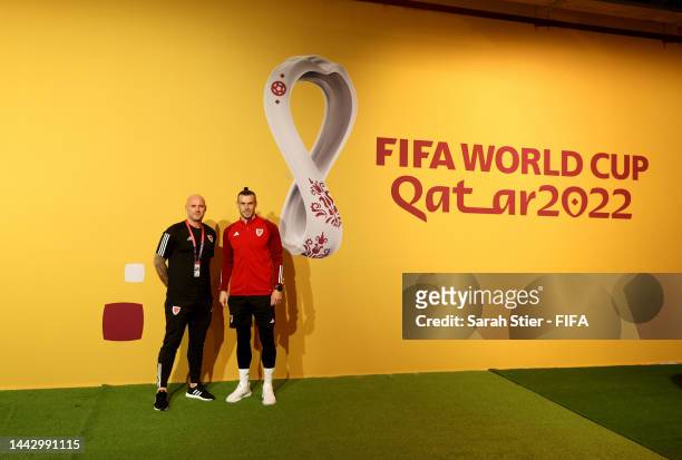 Rob Page, Head Coach of Wales, pose on green carpet with Gareth Bale ahead of the USA Press Conference at the Main Media Center on November 20, 2022...