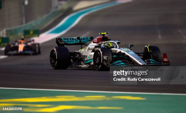 Lewis Hamilton of Great Britain driving the Mercedes AMG Petronas F1 Team W13 leads Lando Norris of Great Britain driving the McLaren MCL36 Mercedes...