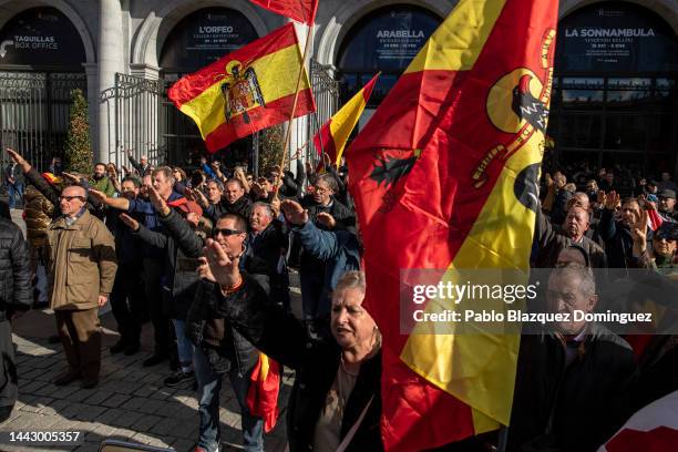 Supporters of Franco do the fascist salute as they hold pre-constitutional flags during a rally commemorating the 47th anniversary of Spain's former...