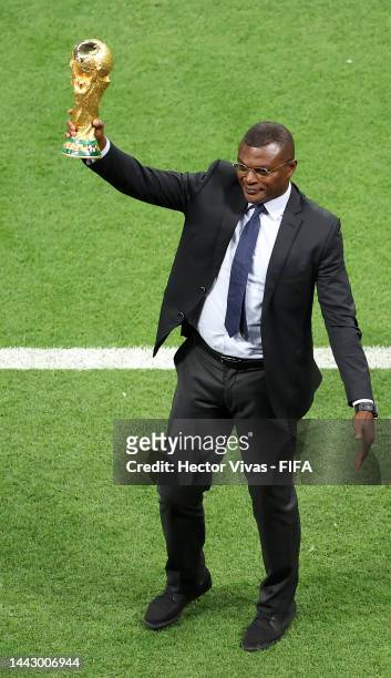 Marcel Desailly brings out the FIFA World Cup Trophy prior to the FIFA World Cup Qatar 2022 Group A match between Qatar and Ecuador at Al Bayt...