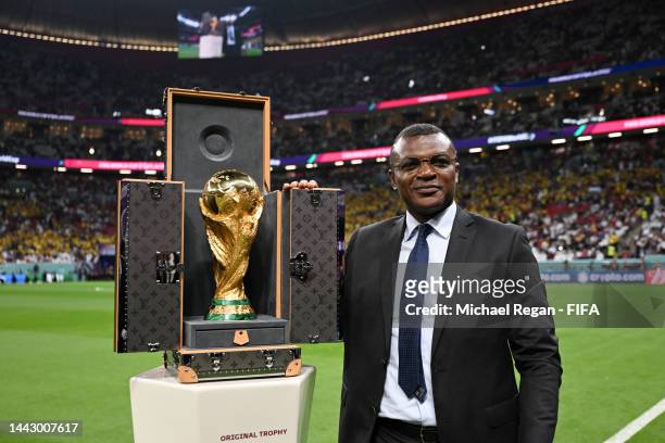 Marcel Desailly brings out the FIFA World Cup Trophy prior to the FIFA World Cup Qatar 2022 Group A match between Qatar and Ecuador at Al Bayt...