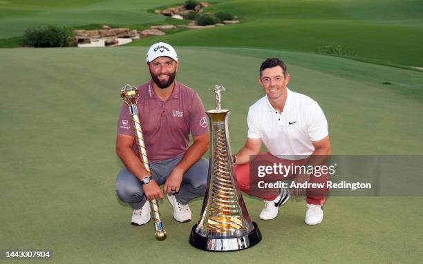 Jon Rahm of Spain poses with DP World Tour Championship trophy and Rory McIlroy of Northern Ireland poses with the Harry Vardon trophy during Day...
