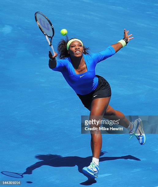 Serena Williams of USA plays a running forehand against Victoria Azarenka of Belarus in the Womens' Singles Final on Day Nine of the Mutua Madrilena...