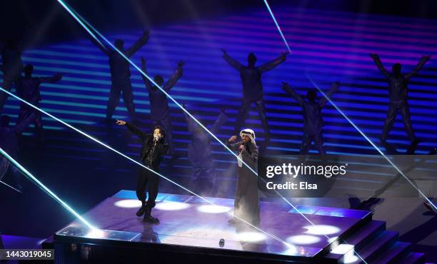 Jung Kook of BTS performs with Fahad Al Kubaisi during the opening ceremony prior to the FIFA World Cup Qatar 2022 Group A match between Qatar and...