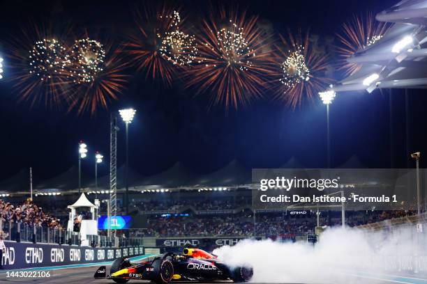 Race winner Max Verstappen of the Netherlands driving the Oracle Red Bull Racing RB18 performs a celebratory donut during the F1 Grand Prix of Abu...