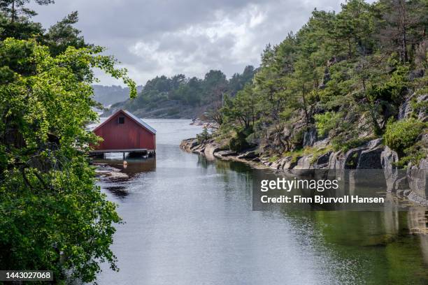 typical norwegian boat house in the bragdøya channel - finn bjurvoll stock pictures, royalty-free photos & images