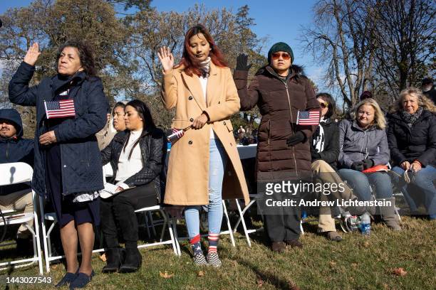 New American citizens attend a naturalization ceremony held on the anniversary of President Abraham Lincolns Gettysburg Address speech, November 19...