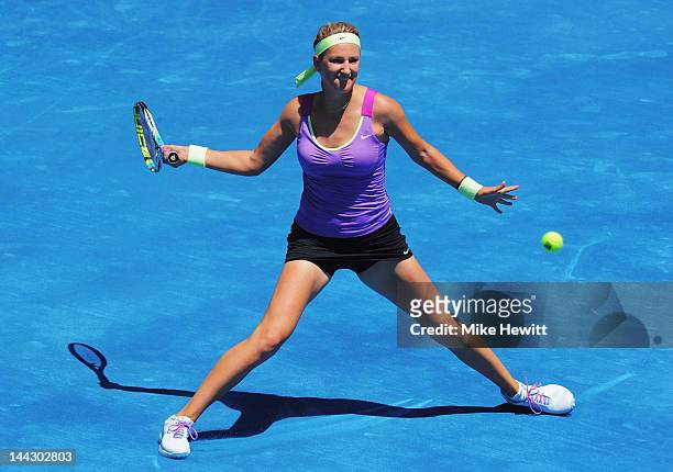 Victoria Azarenka of Belarus in action against Serena Williams of USA in the Womens' Singles Final on Day Nine of the Mutua Madrilena Madrid Open at...