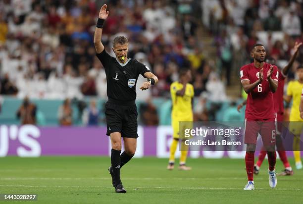 Referee Daniele Orsato dismisses Ecuador's first goal after checking with the Video Assistant Referee on the first goal of Ecuador during the FIFA...