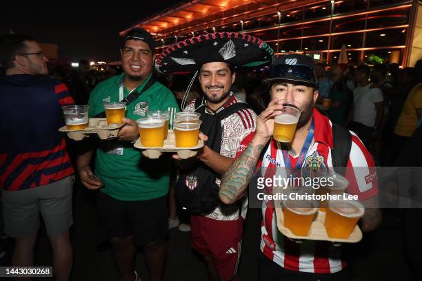 Fans drink beer during day 2 of the FIFA World Cup 2022 Qatar Fan Festival at Al Bidda Park on November 20, 2022 in Doha, Qatar.