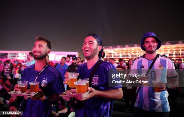Fans drink beer during day 2 of the FIFA World Cup 2022 Qatar Fan Festival at Al Bidda Park on November 20, 2022 in Doha, Qatar.