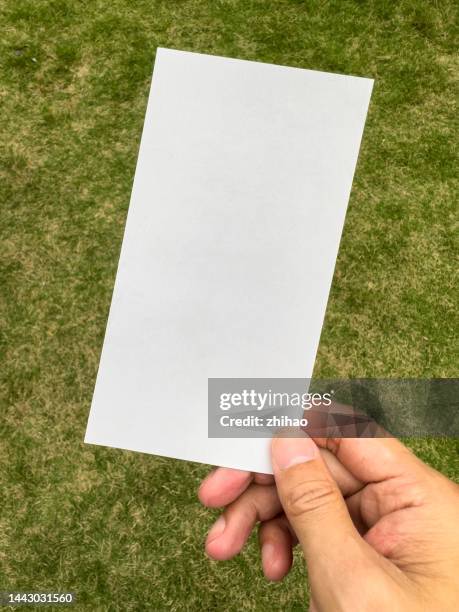 card in hand - manifesto stock pictures, royalty-free photos & images