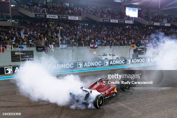 Second placed Charles Leclerc of Monaco and Ferrari performs a celebratory donut in parc ferme following the F1 Grand Prix of Abu Dhabi at Yas Marina...