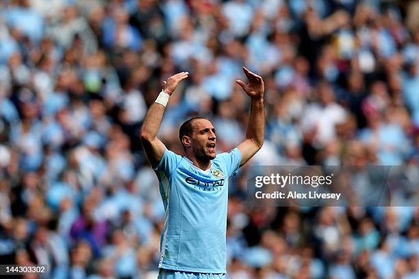 Pablo Zabaleta of Manchester City celebrates after scoring the opening goal during the Barclays Premier League match between Manchester City and...