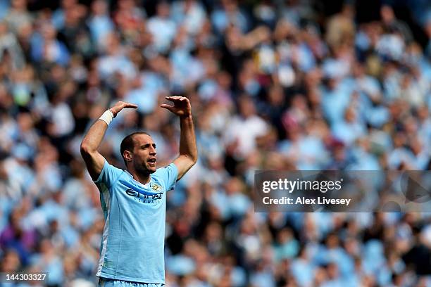 Pablo Zabaleta of Manchester City celebrates after scoring the opening goal during the Barclays Premier League match between Manchester City and...