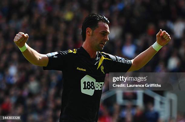 Chris Eagles of Bolton Wanderers celebrates as Mark Davies scores their first goal during the Barclays Premier League match between Stoke City and...
