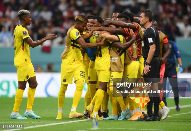 Enner Valencia of Ecuador celebrates with teammates after scoring their team's second goal during the FIFA World Cup Qatar 2022 Group A match between...