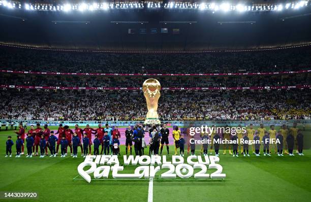 Players and match officials line up prior to the FIFA World Cup Qatar 2022 Group A match between Qatar and Ecuador at Al Bayt Stadium on November 20,...