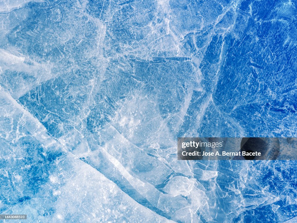 Full frame of frozen water surface in a river in the form of ice.