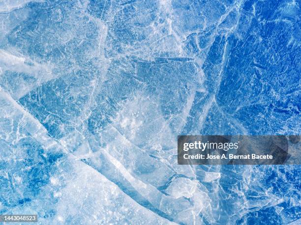 full frame of frozen water surface in a river in the form of ice. - ice texture foto e immagini stock