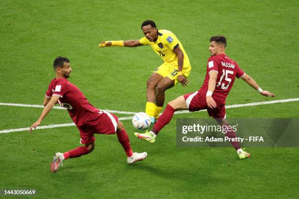 Romario Ibarra of Ecuador shoots at goal while Abdulaziz Hatem and Bassam Alrawi of Qatar attempt to block during the FIFA World Cup Qatar 2022 Group...