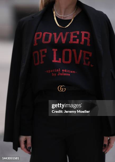 Julia Conrad seen wearing black Gucci loafer, Gucci belt, a black sweater from Julove, black Cos pants and black Zara blazer on November 18, 2022 in...